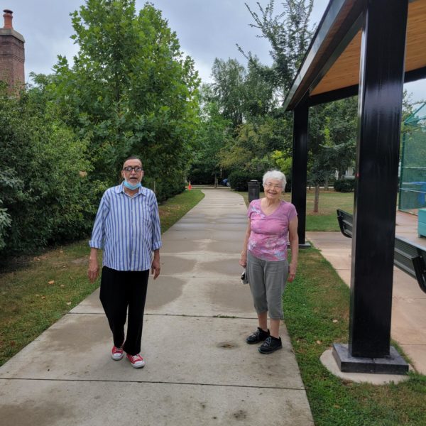 Seniors walking outside an ELC property.